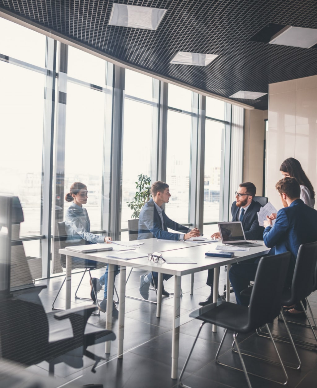 business-executives-with-headsets-using-computer 1-min